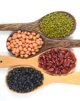 Seeds beans(Black Bean, Red Bean, Peanut and Mung Bean) useful for health in wood spoons on white background.
